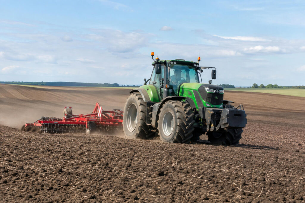 Tractor working on cultivated farmland